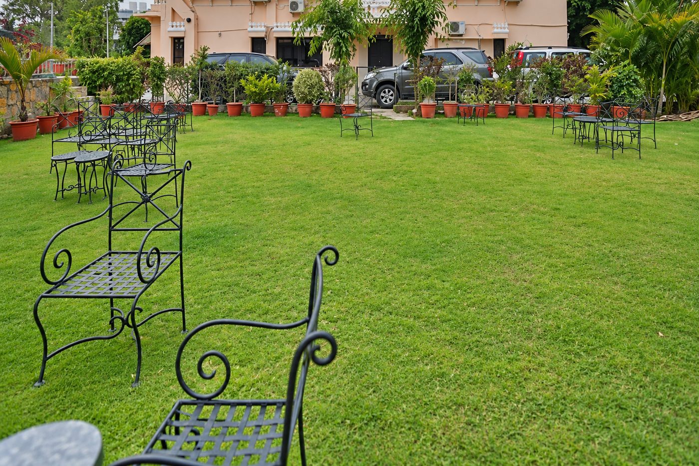 Inder Prakash · Udaipur — lawn with a potted border